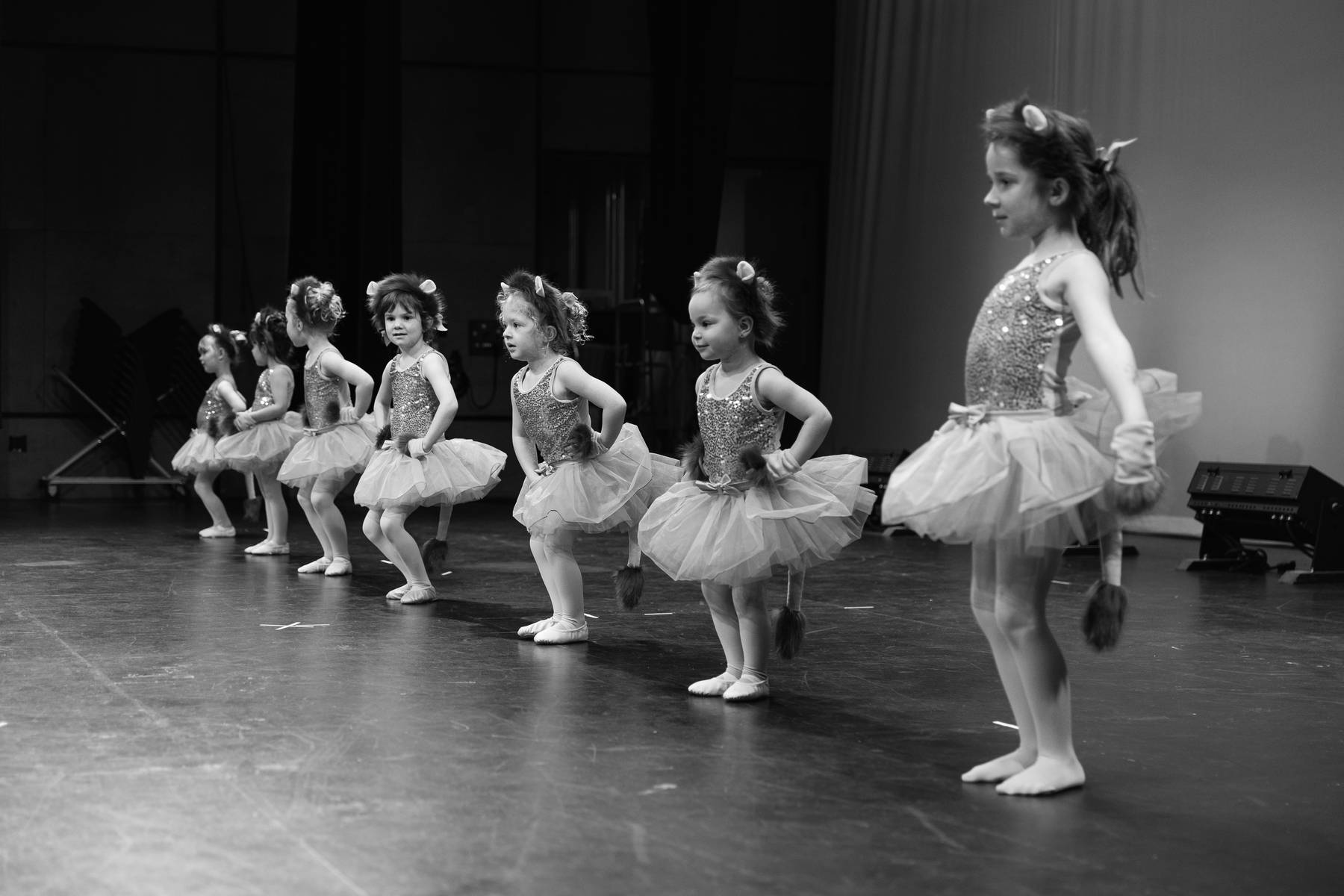 Young dancers posing together on stage