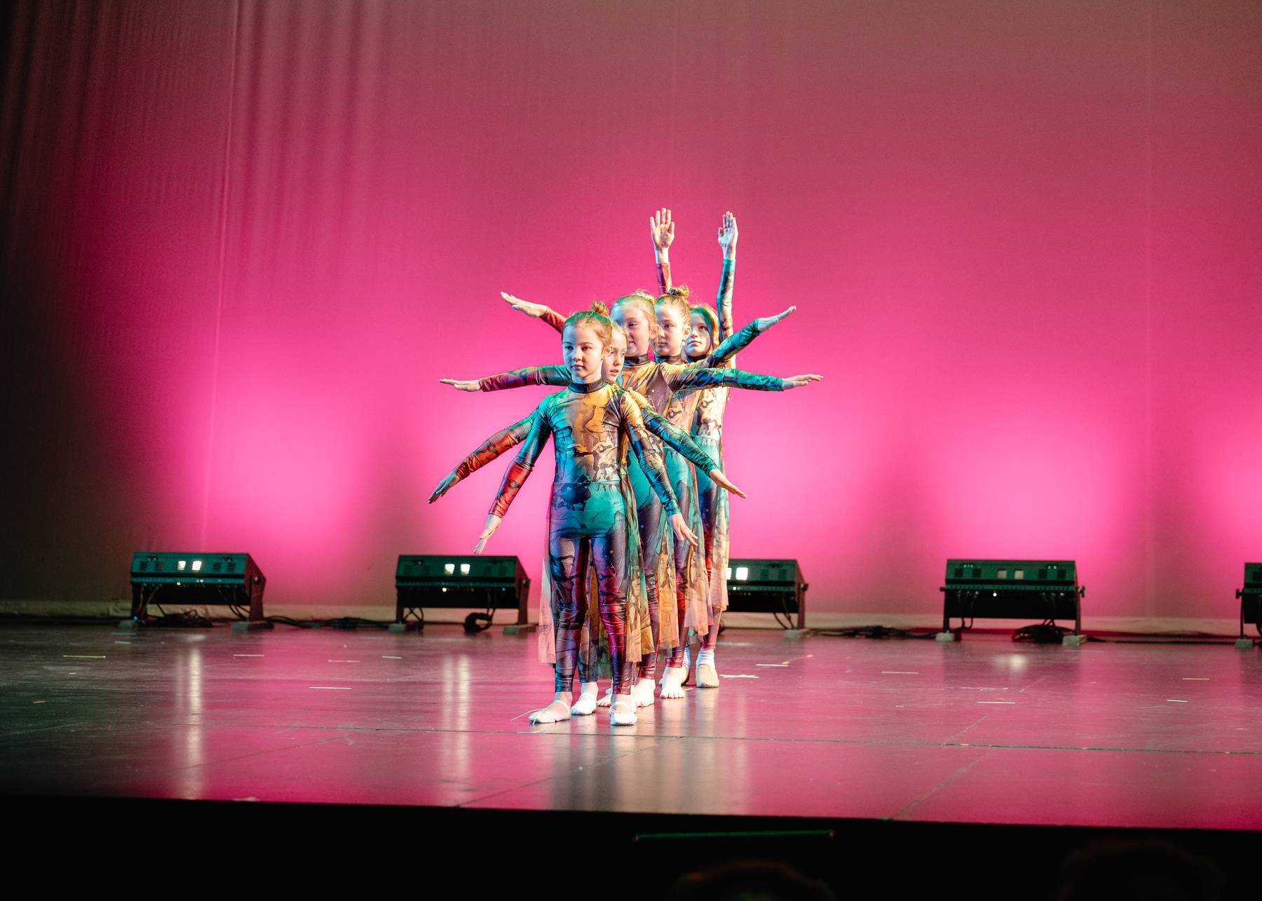 Dancers performing together on stage