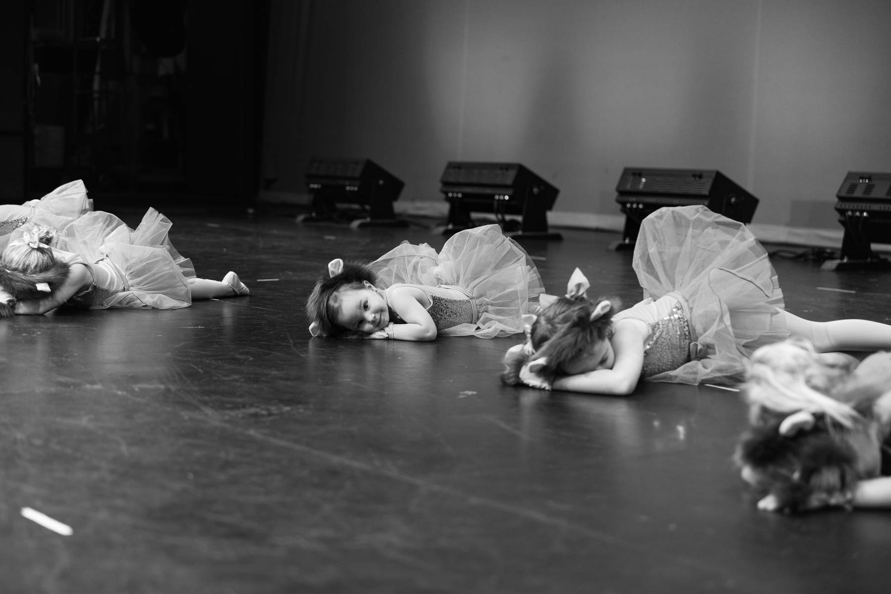 Dancers performing together on a theater stage